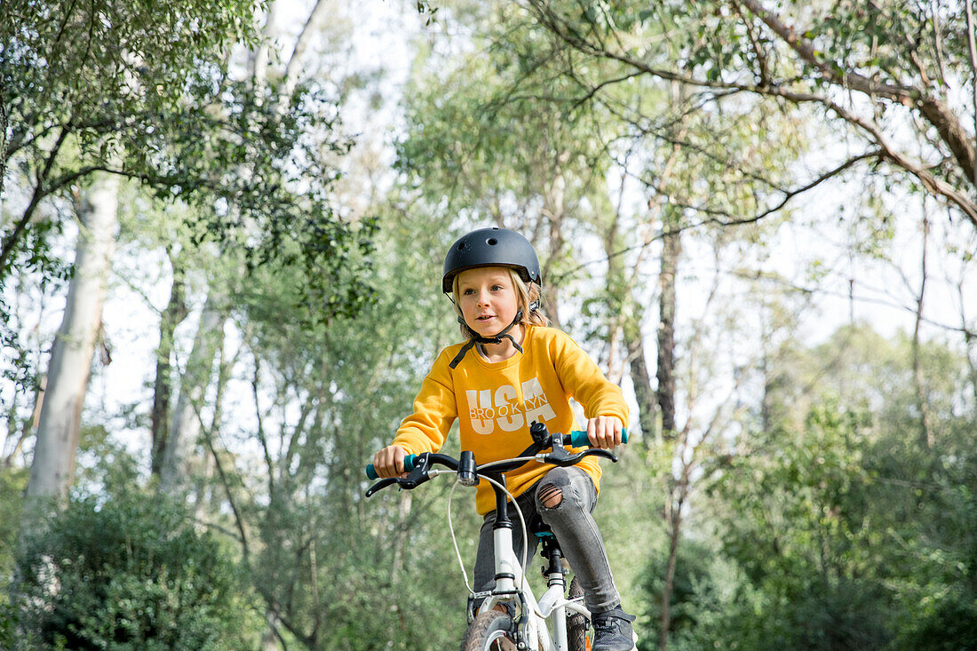 Girl cycling at summer