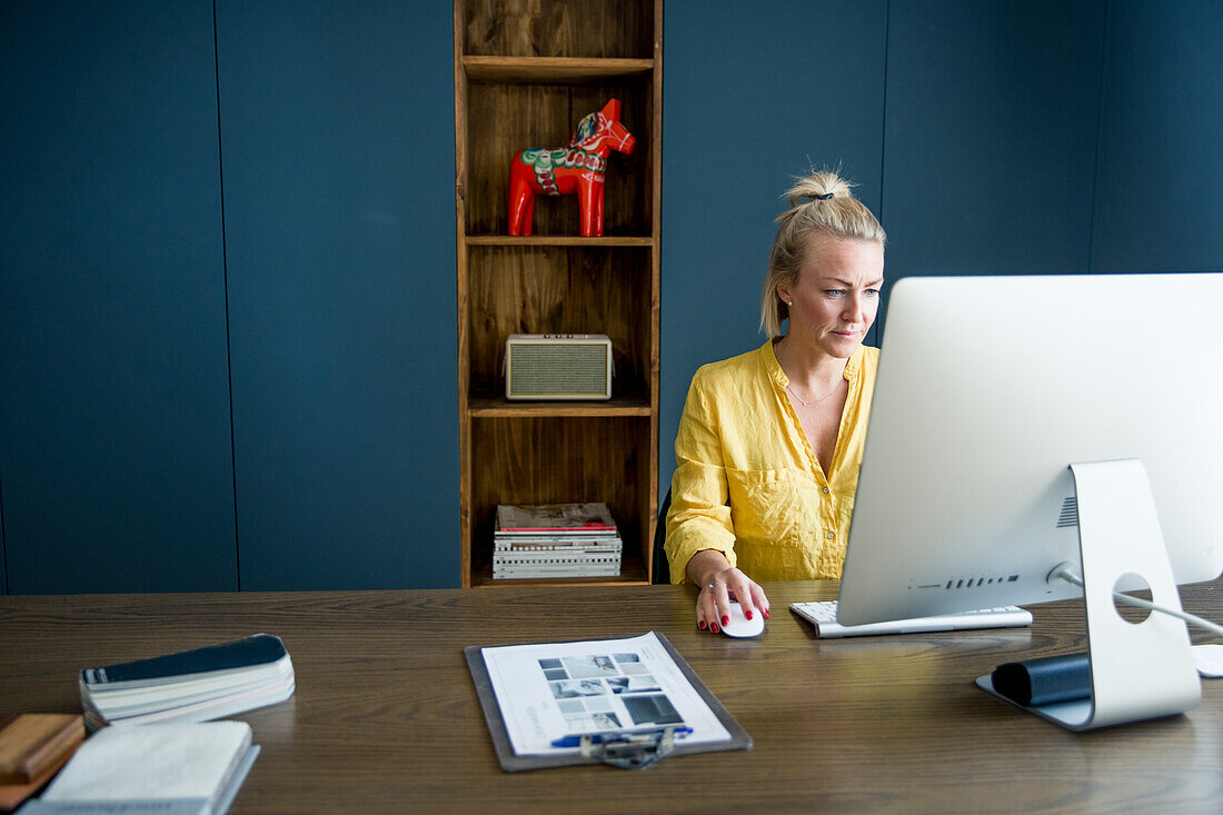 Woman in office using computer