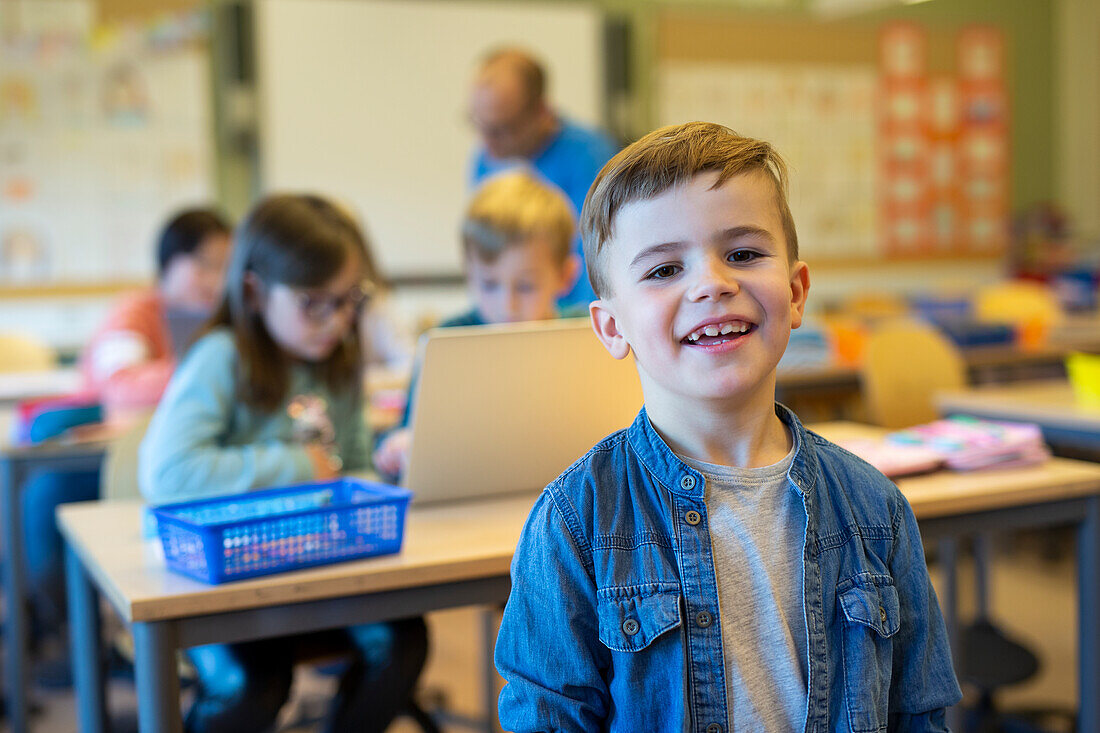 Smiling boy in classroom