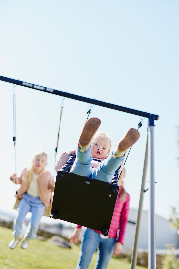 Toddler girl on swing