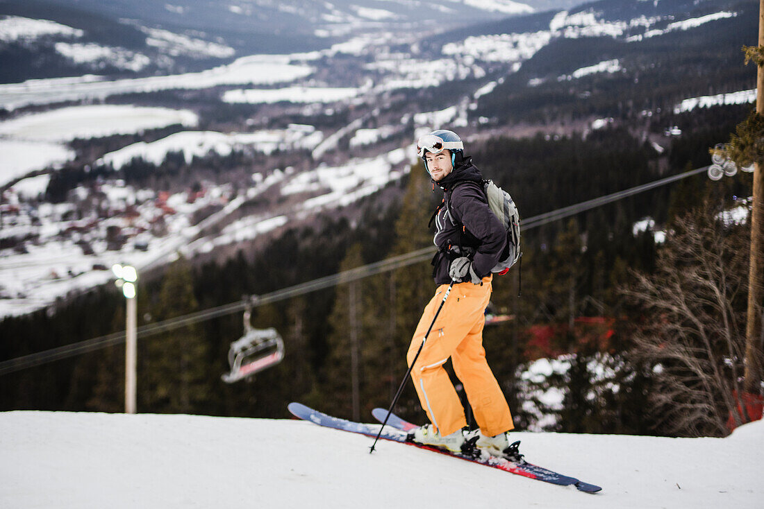 Skier at winter looking at camera
