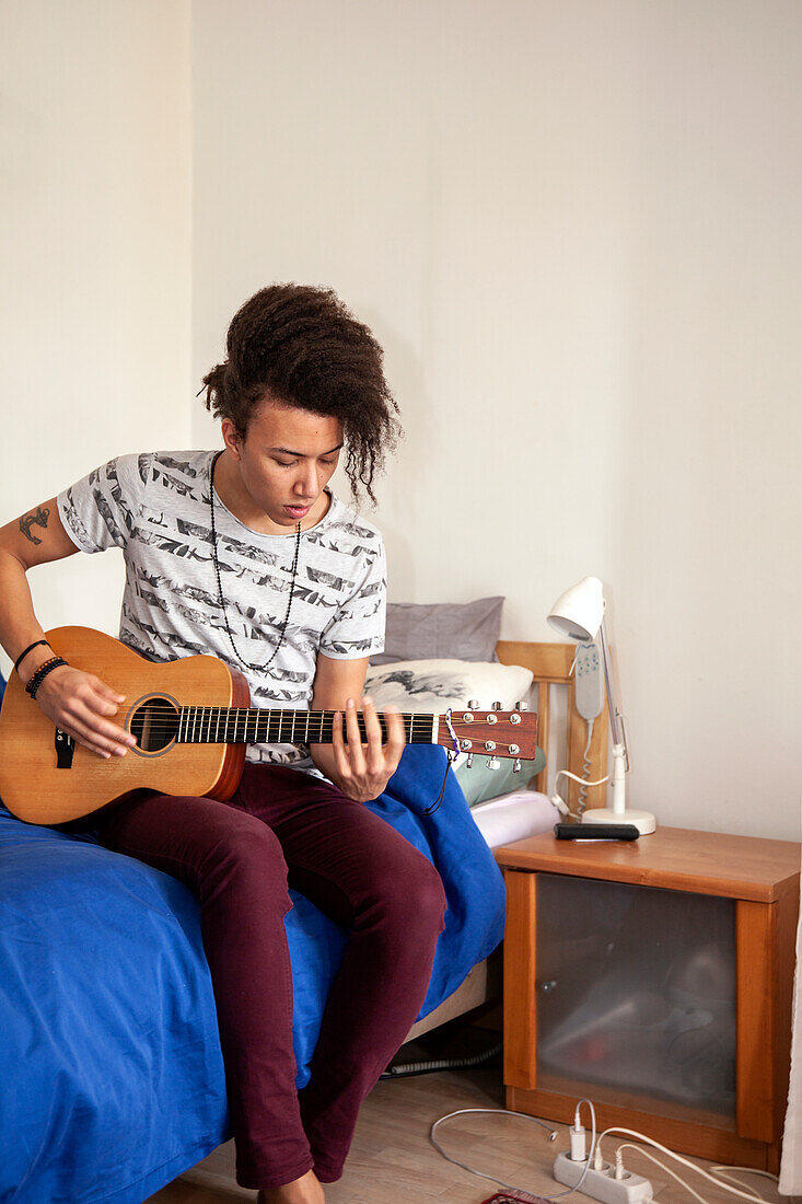 Young man playing guitar