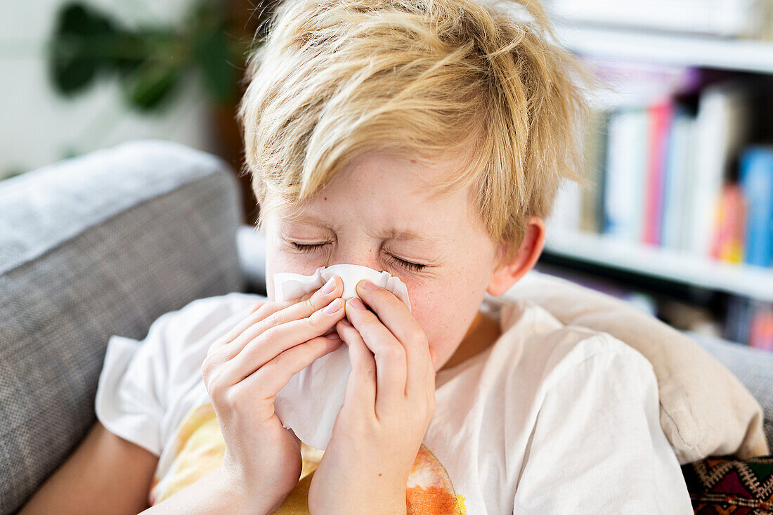 Boy sneezing