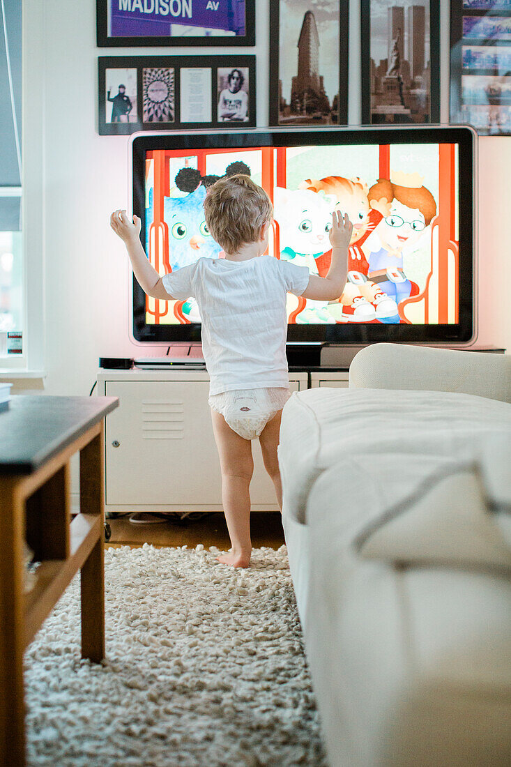 Boy watching cartoons in TV