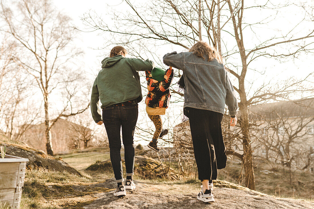 Women with daughter having walk