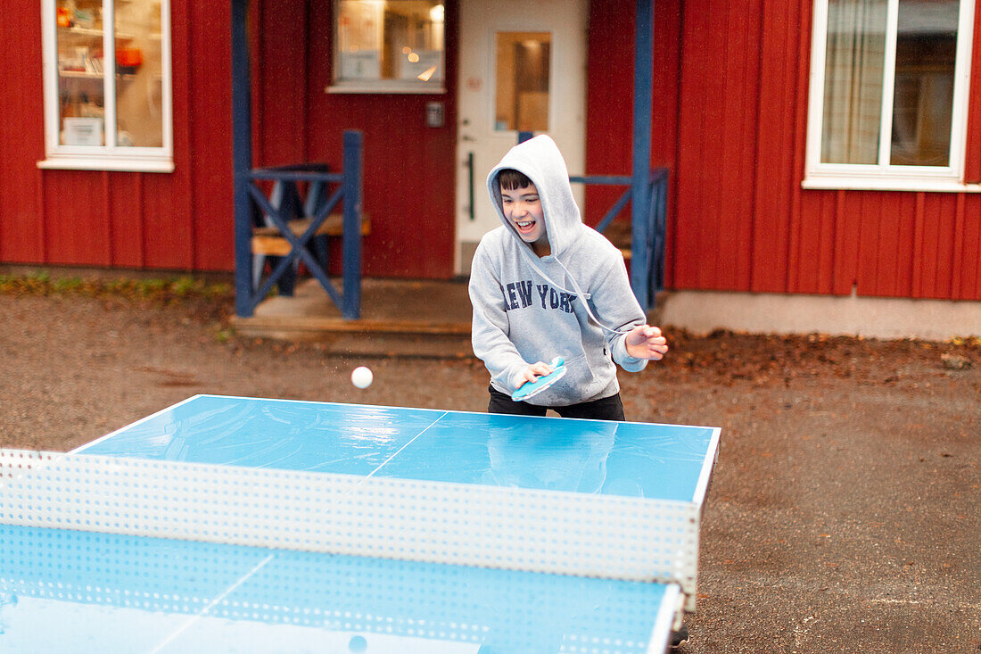 Boy playing table tennis