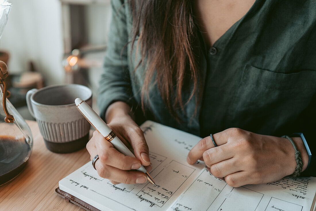 Woman taking notes in her diary