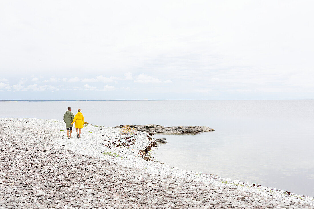 Couple walking at sea