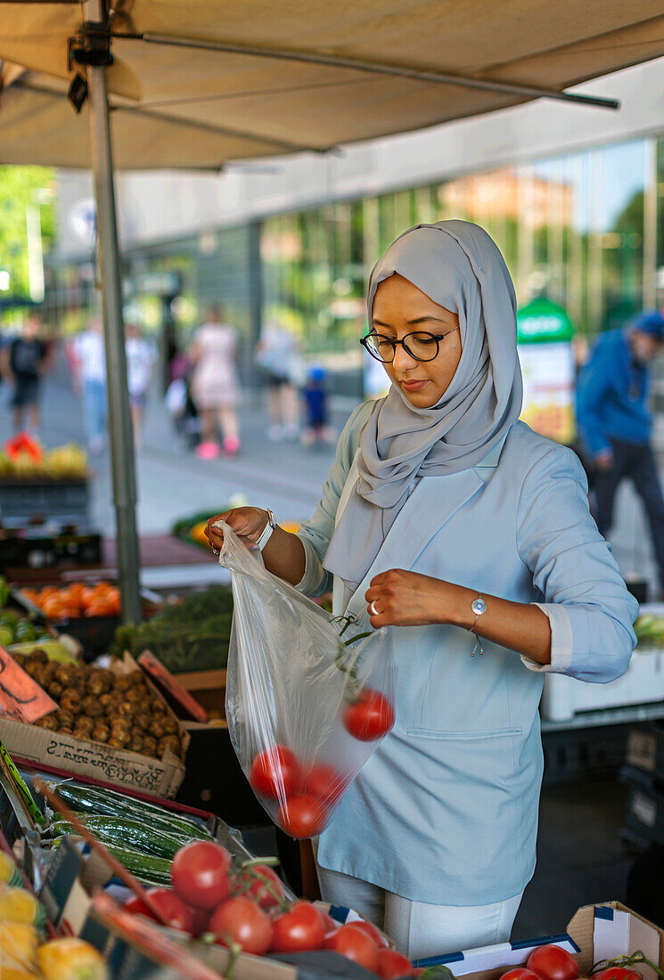 Woman wearing hijab doing shopping