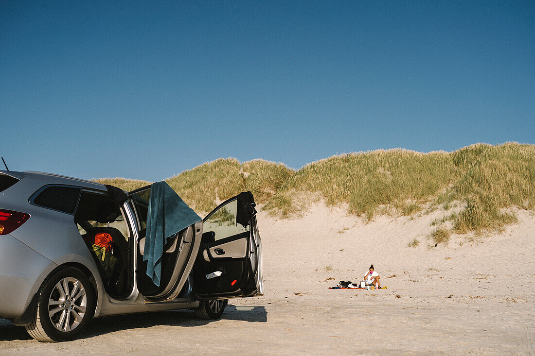 Car parked on sandy beach