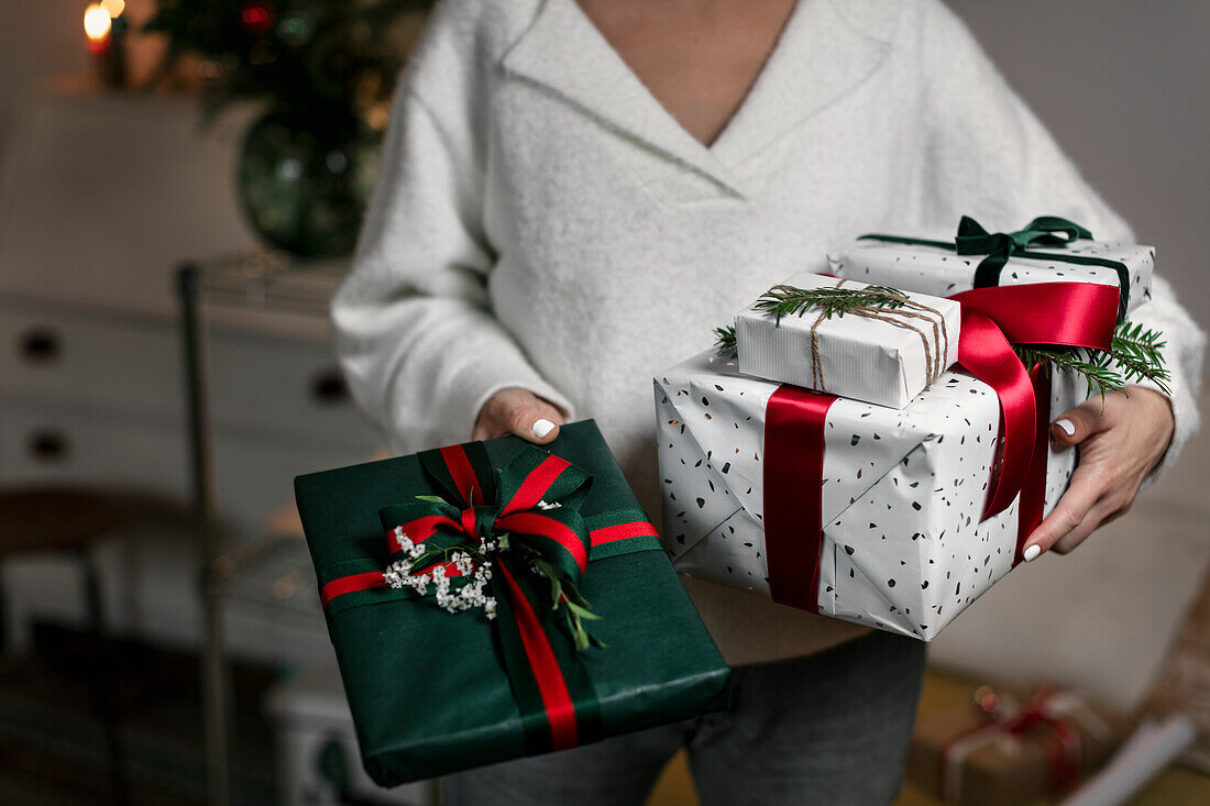Woman holding Christmas presents