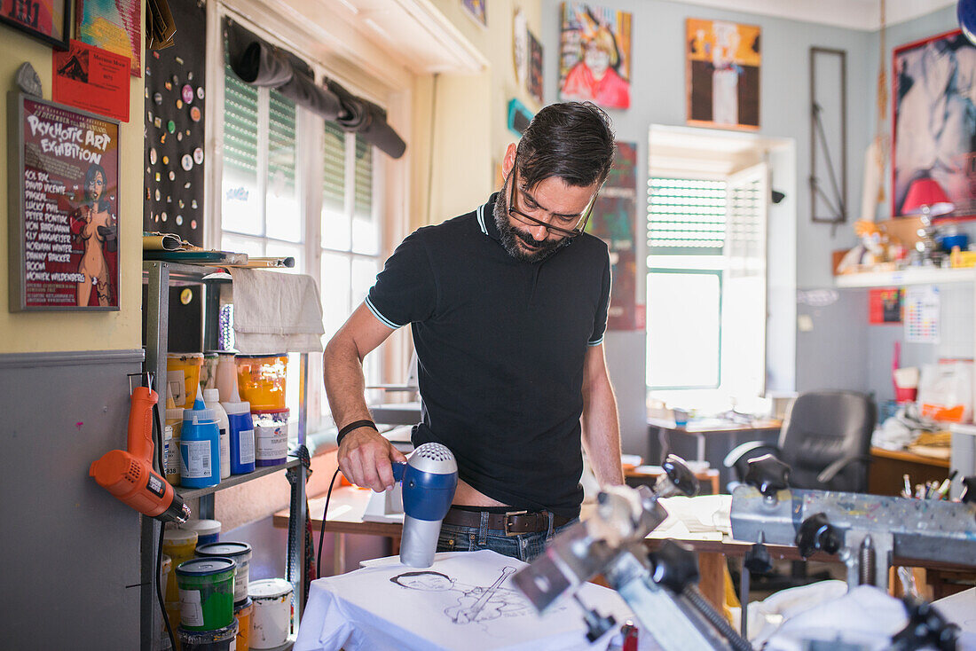 Man drying freshly printed top