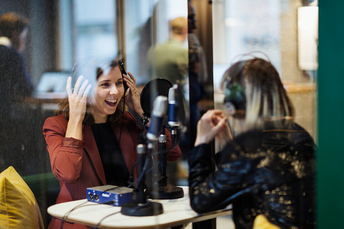Women broadcasting from radio station