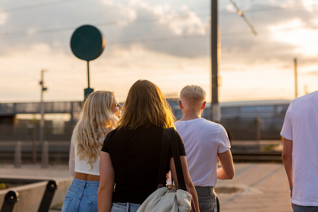 Young friends walking together