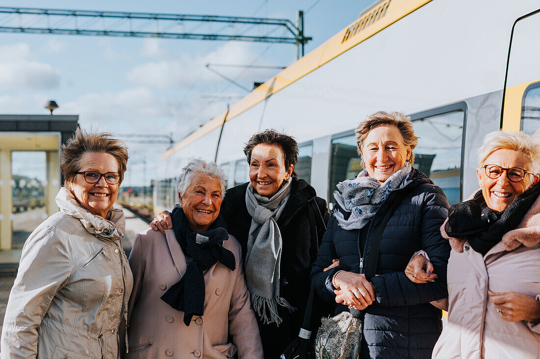 Women on train station platform