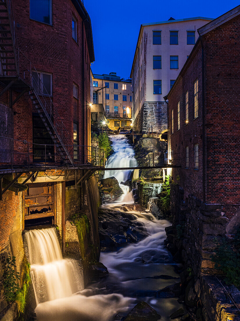 Urban waterfall in old industrial area, Kvarnbyn near Molndal, Sweden