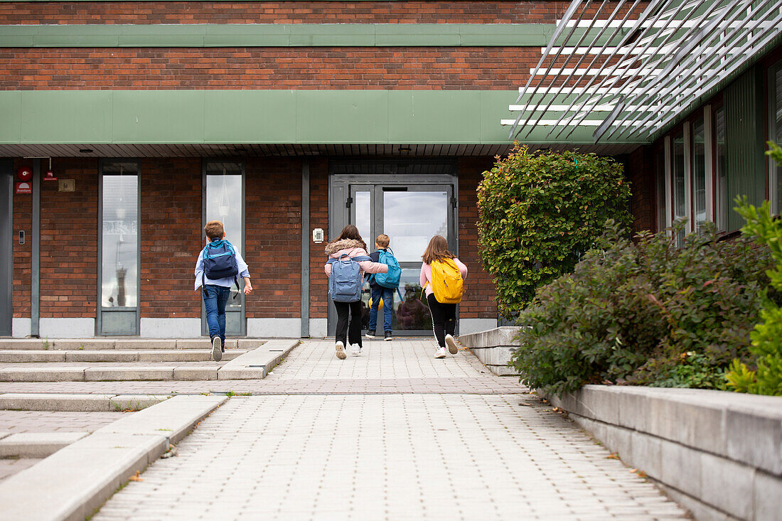 Children in front of school building