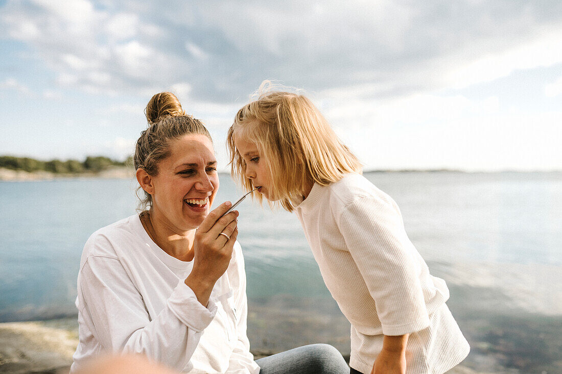 Mother with daughter at sea