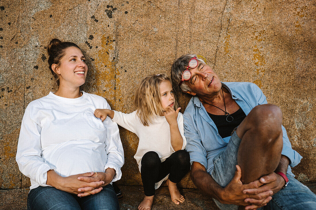 Family relaxing at sea