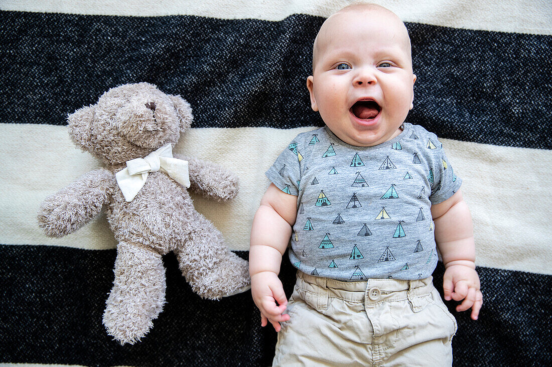 Happy baby boy looking at camera