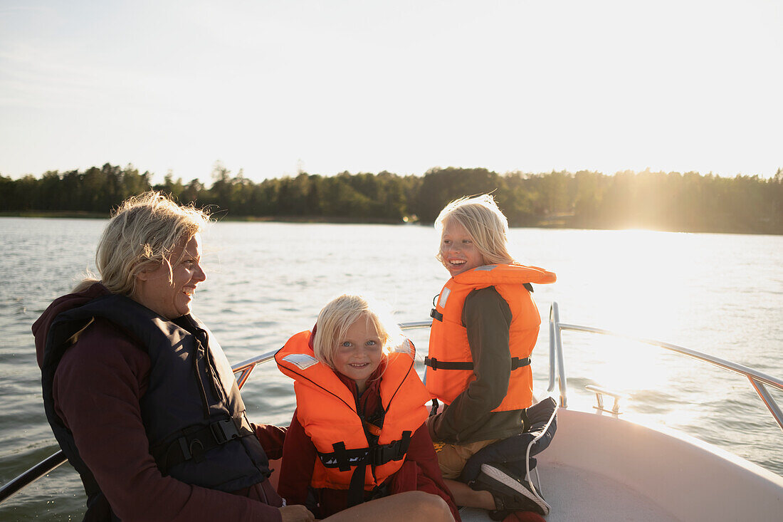 Mother with children on boat