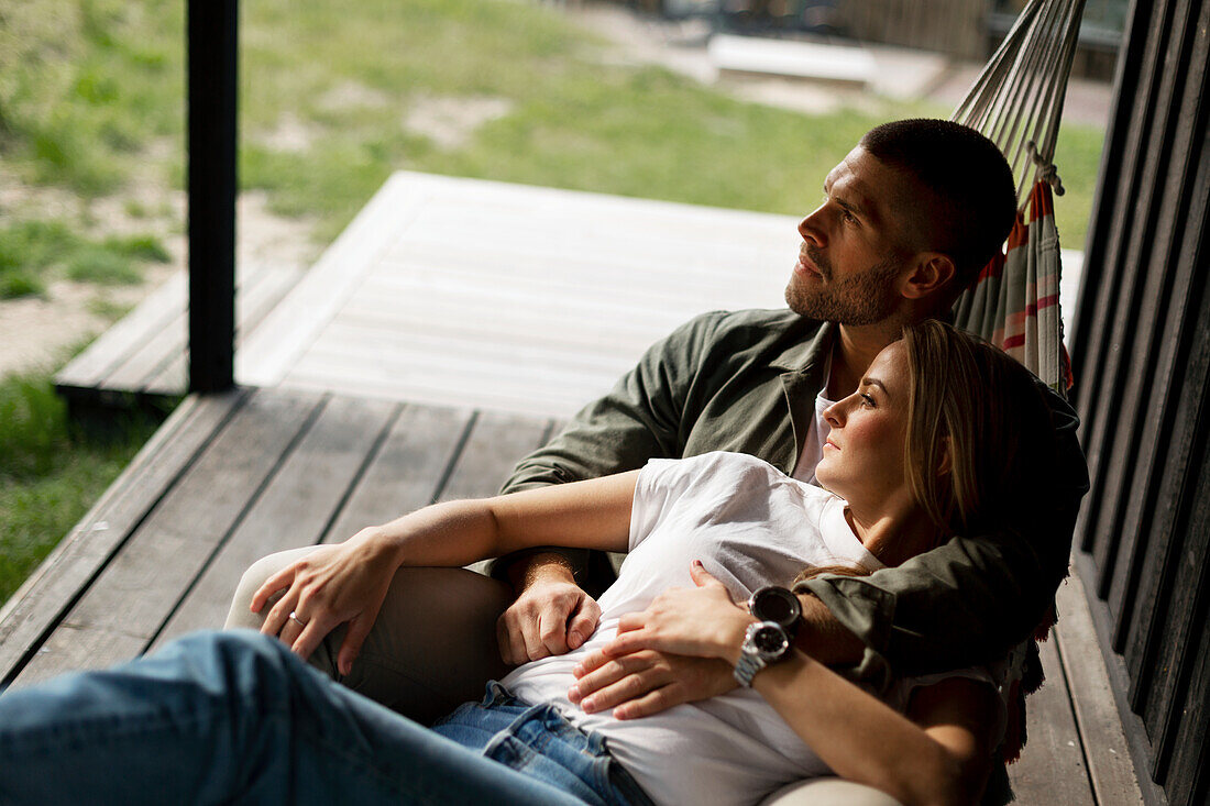 Young couple relaxing on hammock