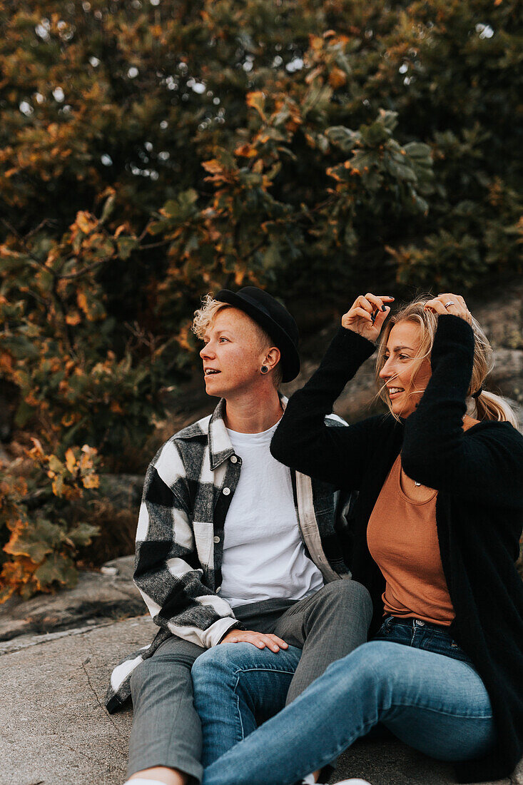 Female couple sitting together