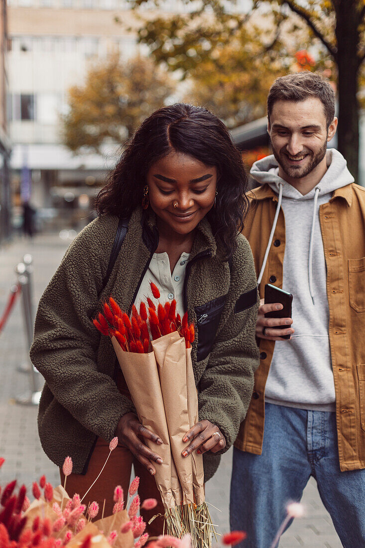 Woman buying flowers