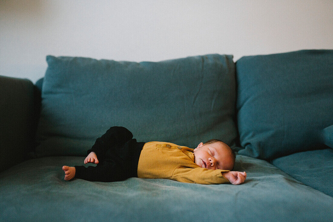 Baby sleeping on sofa