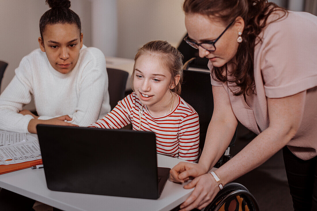 Girl on wheelchair in classroom