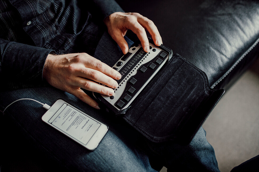 Man using Braille keyboard