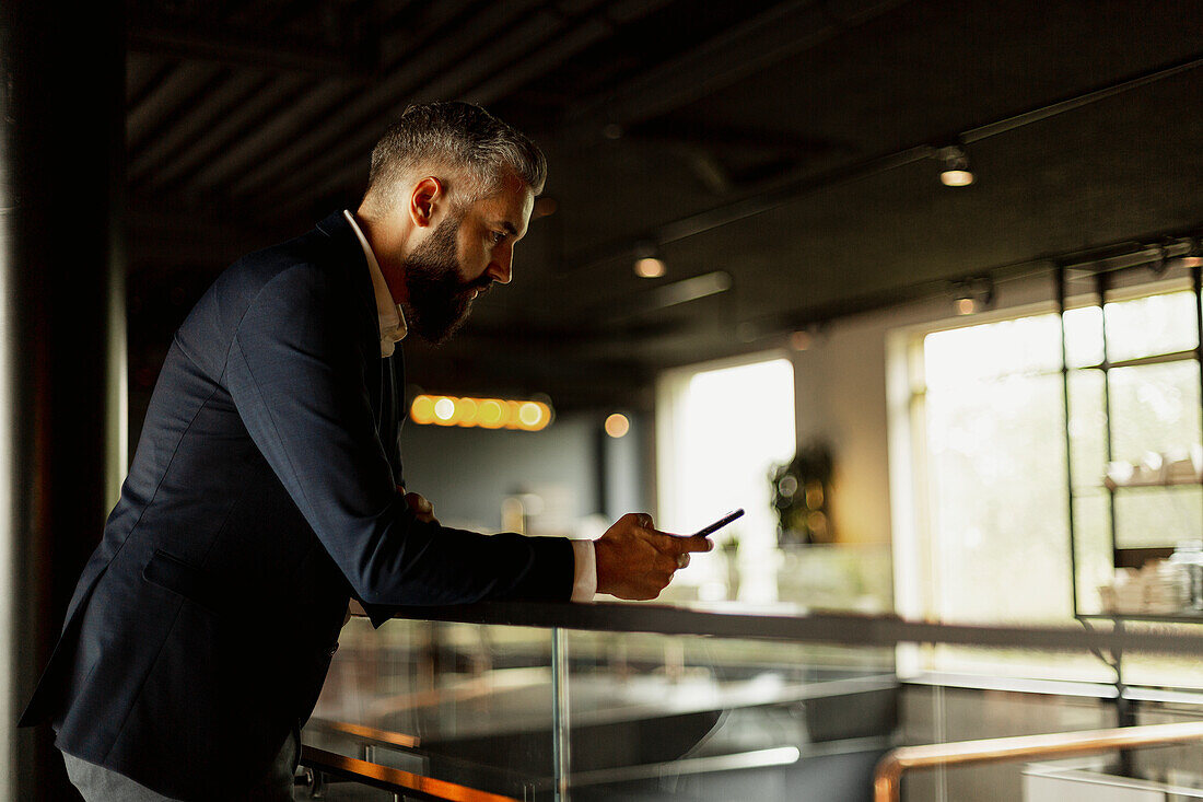 Businessman using cell phone