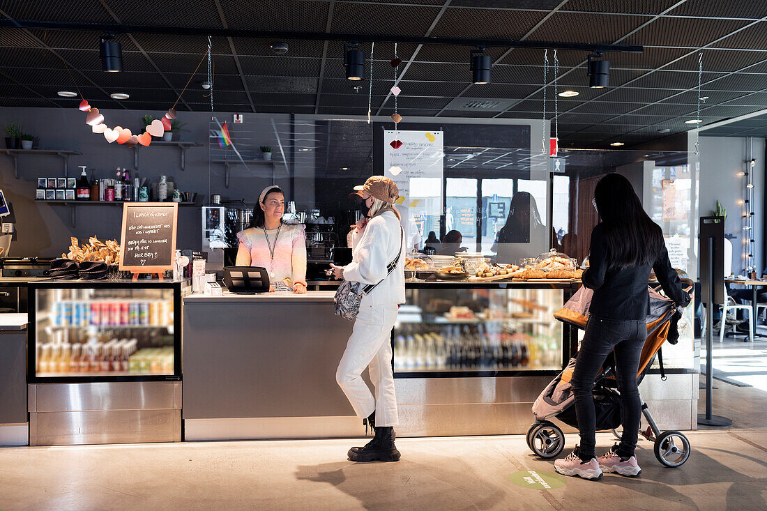 Women standing in line in cafeteria