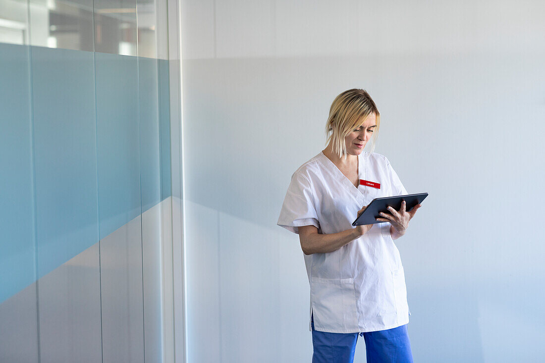 Female doctor using digital tablet in hospital