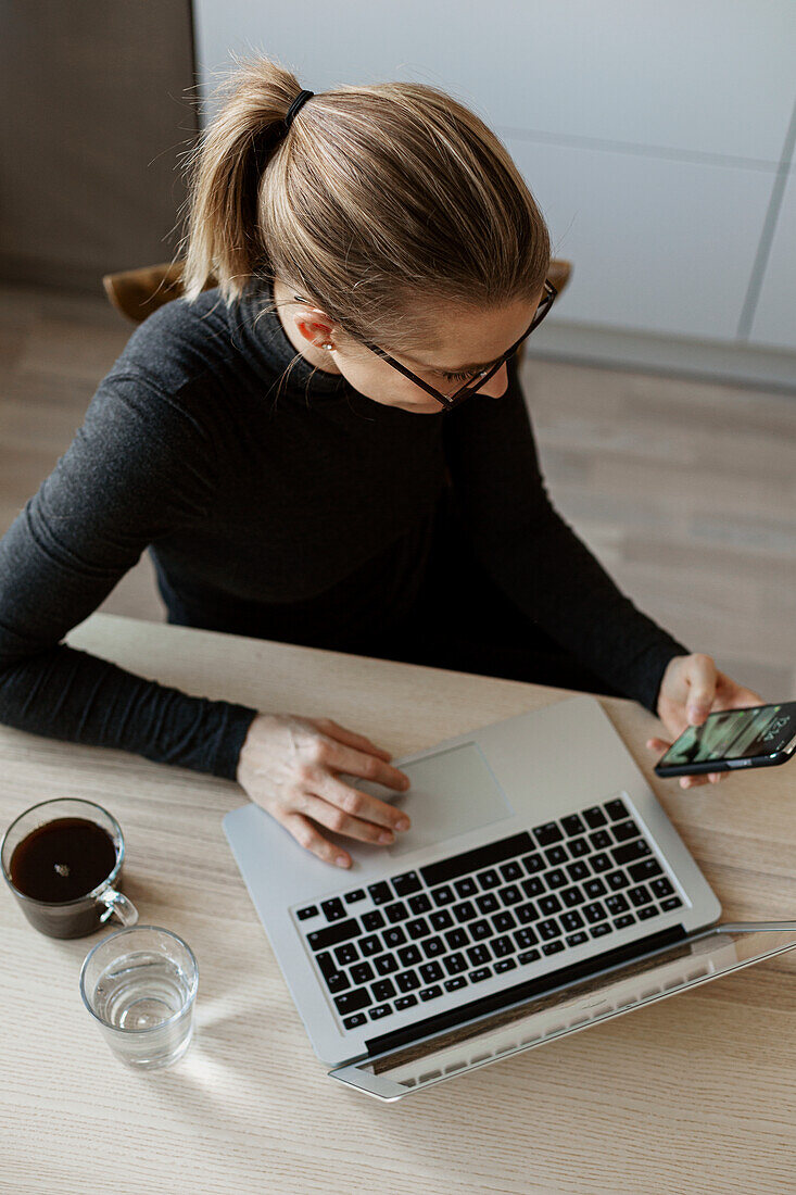 High angle view of woman using cell phone