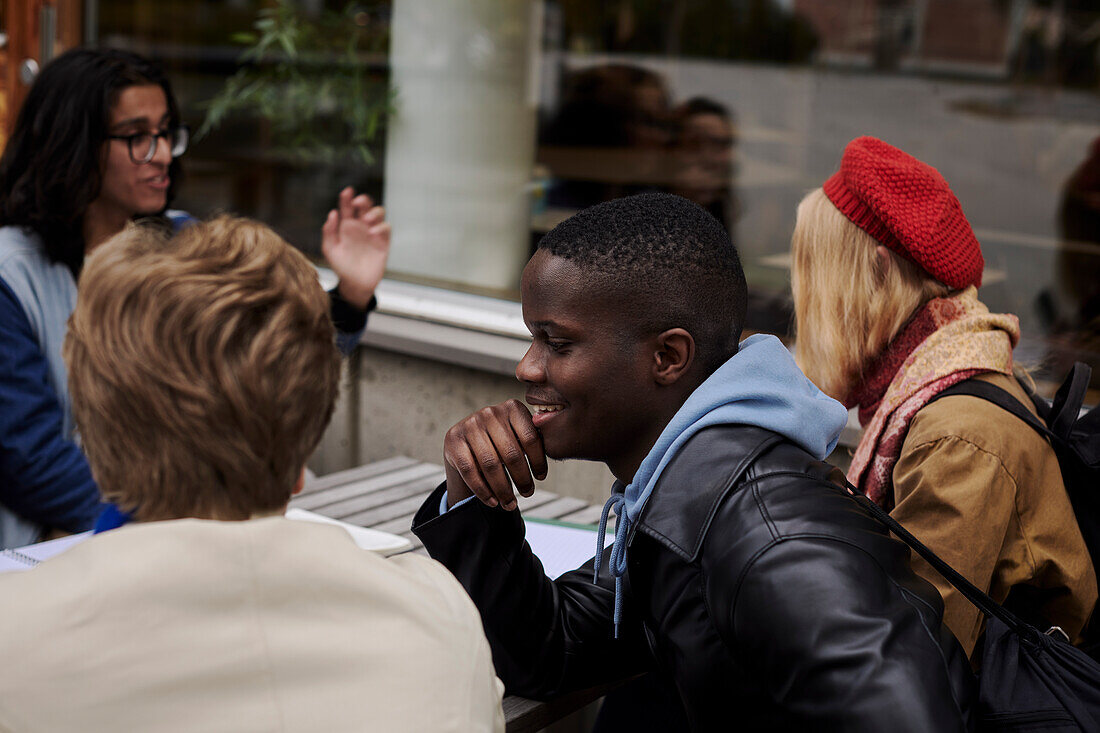 Young friends sitting together