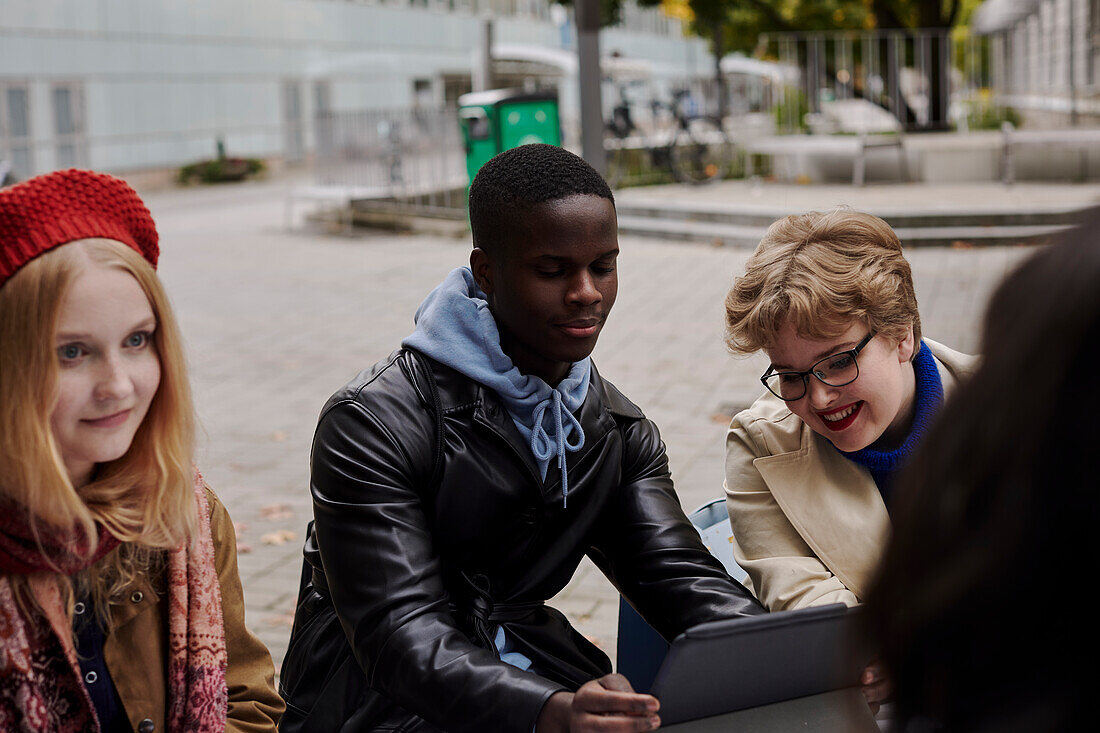 Young friends sitting together