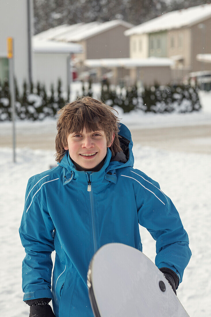 Smiling teenage boy at winter