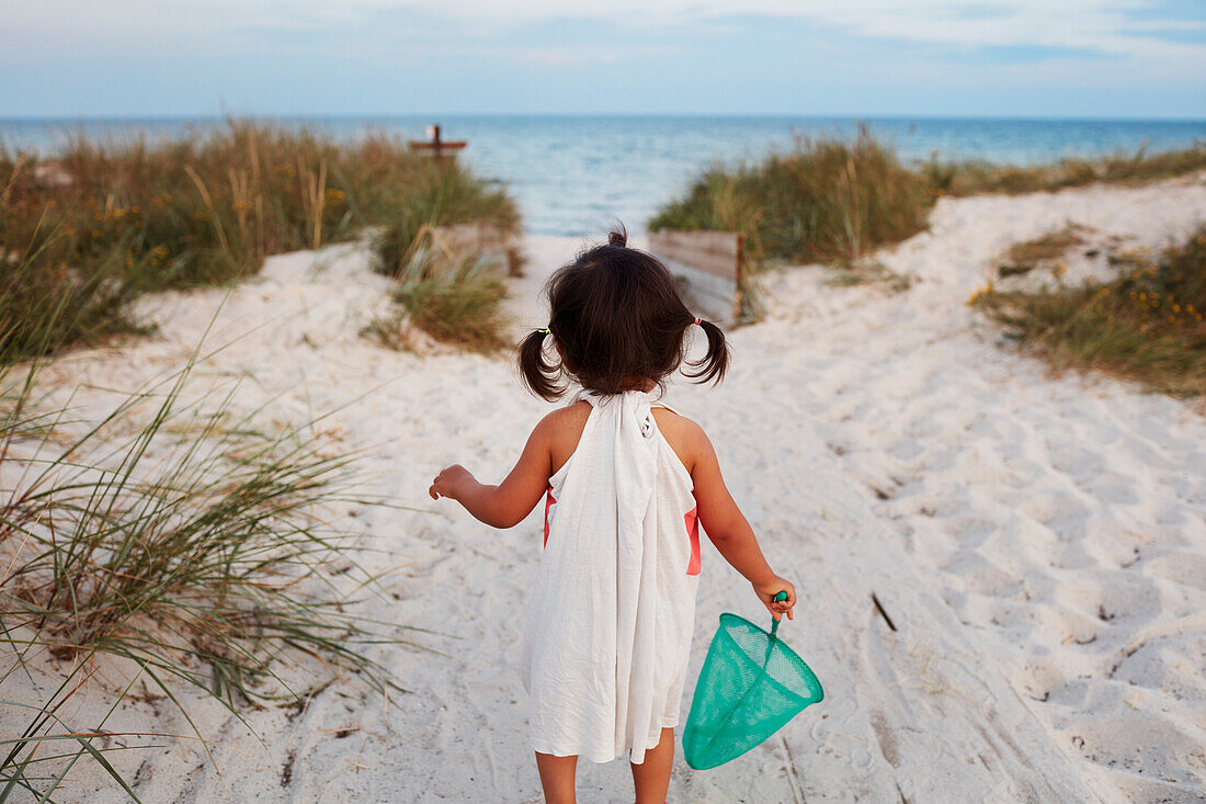 Rear view of girl at sea