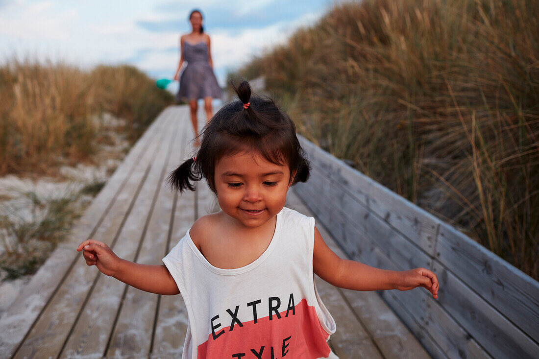 Smiling girl on boardwalk