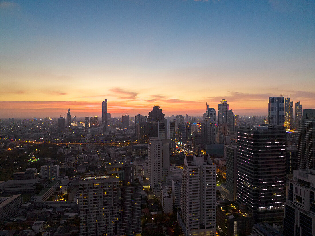 Modern cityscape of business district at sunset