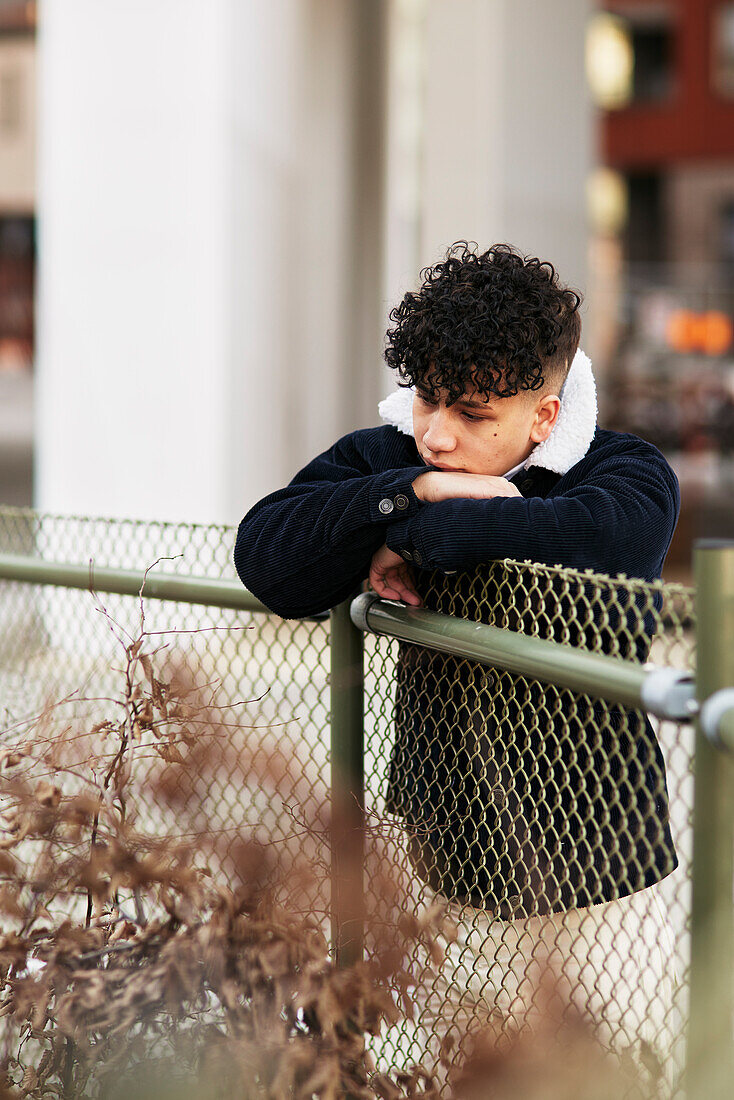 Teenage boy looking away