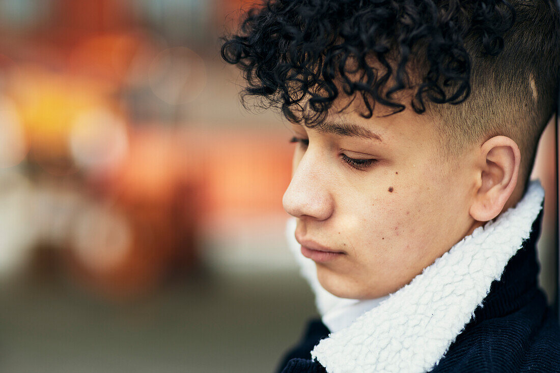 Teenage boy looking away