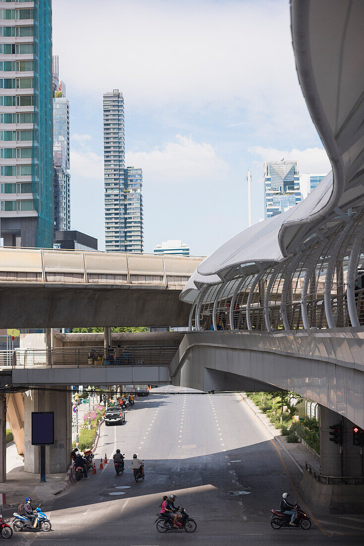 Pedestrian overpass and skyscraper in city center