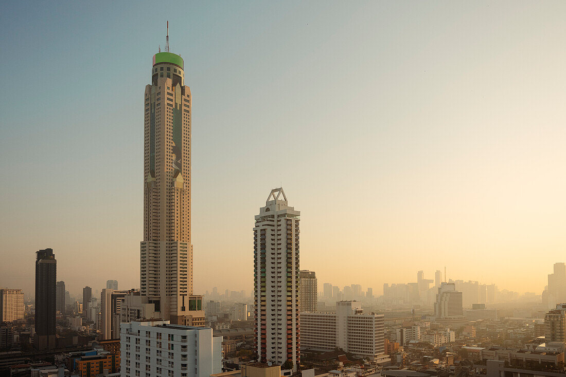 Cityscape with skyscrapers at sunrise