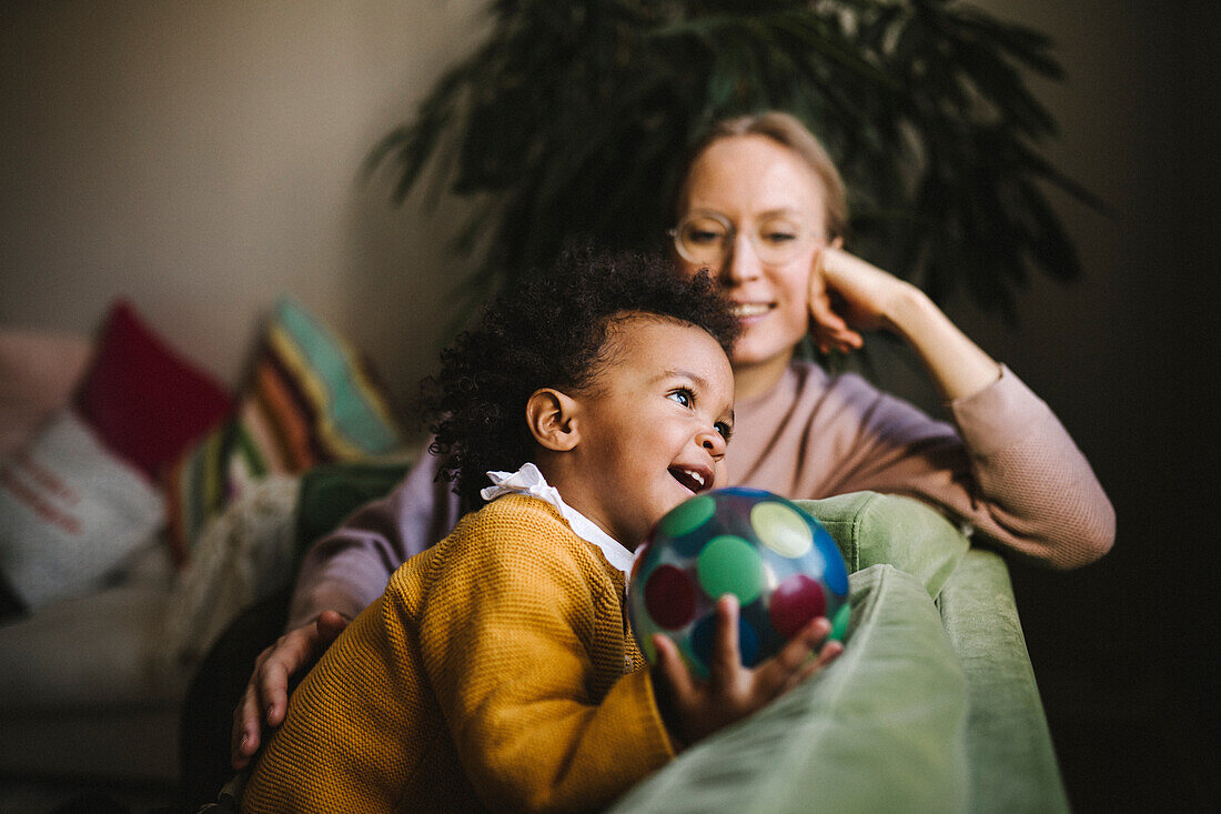 Mother and daughter relaxing at home