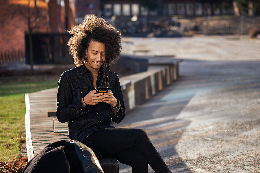 Young man using cell phone