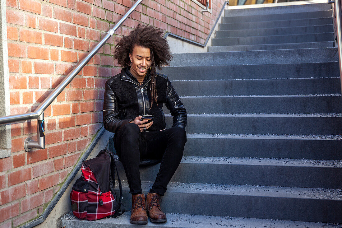 Young man using cell phone