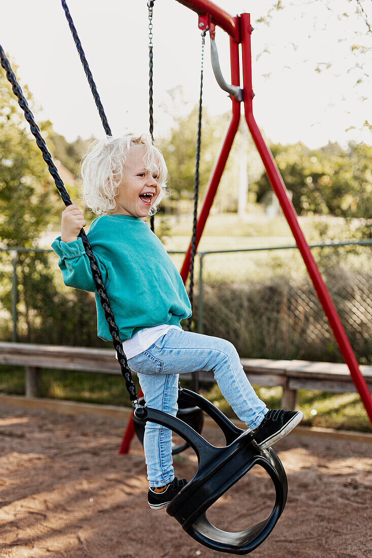 Happy child swinging