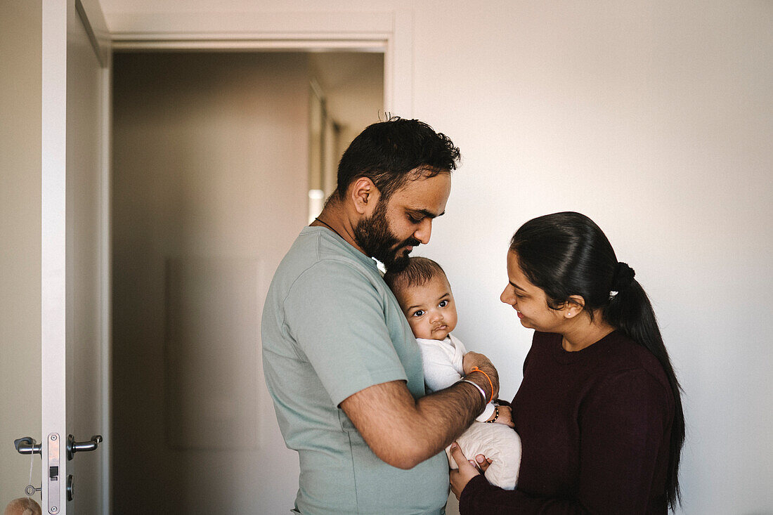 Father and mother with baby